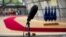 In-house cameras and a microphone are set up at the arrivals area for EU leaders at the European Council building in Brussels, July 16, 2020.