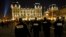 FILE - French police officers patrol near Notre Dame Cathedral as worshippers arrive for the Christmas eve mass in Paris, Dec. 24, 2016.