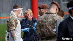Soldiers are seen outside a coronavirus disease (COVID-19) testing centre in Liverpool, Britain, Nov. 7, 2020. 