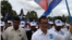 Opposition leader Sam Rainsy is welcomed in Siem Reap by thousands supporters during a election rally on July 24, 2013. 