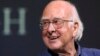 FILE - Britain's Professor Peter Higgs smiles during a press conference in Edinburgh, Scotland, on Oct. 11, 2013. The University of Edinburgh says Nobel prize-winning physicist Peter Higgs, who proposed the existence of the Higgs boson particle, has died at 94.
