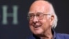 FILE - Britain's Professor Peter Higgs smiles during a press conference in Edinburgh, Scotland, on Oct. 11, 2013. The University of Edinburgh says Nobel prize-winning physicist Peter Higgs, who proposed the existence of the Higgs boson particle, has died at 94.