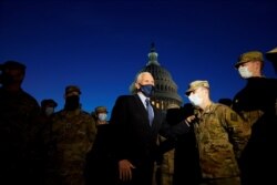 Vice President Mike Pence speaks to National Guard troops outside the U.S. Capitol, Jan. 14, 2021.