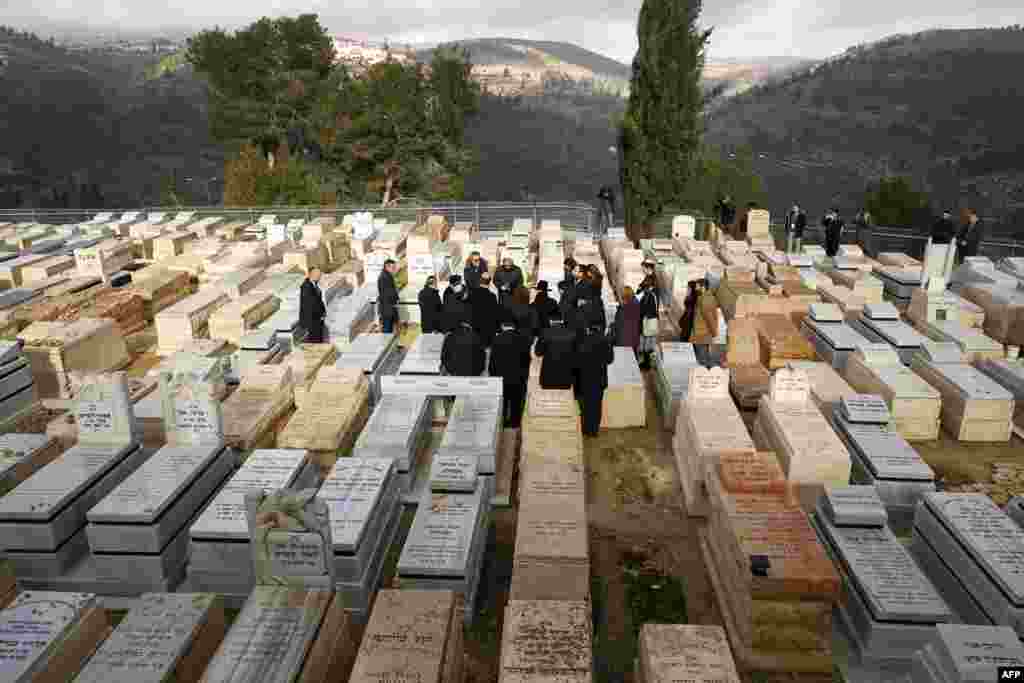 French Interior Minister Christophe Castaner visits the graves of the victims of the Ozar Hatorah school attack in Toulouse, at the Israeli cemetery of Givat Shaul in Jerusalem.