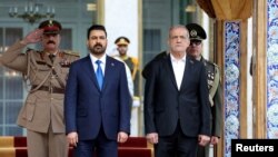 علی الزیدی، نخست‌ وزیر عراق، در کنار مسعود پزشکیان، رئیس‌ جمهوری رژیم ایران (آرشیو)