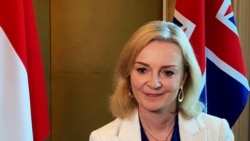 FILE - Liz Truss speaks to Reuters after signing a free trade agreement with Singapore, in Singapore, Dec. 10, 2020.