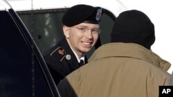 Army Pfc. Bradley Manning, center, steps out of a security vehicle as he is escorted into a courthouse in Fort Meade, Md., Nov. 28, 2012.