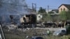 A man walks past a house burning in the city of Pokrovsk, in the Donetsk region, Sept. 21, 2024, after a recent strike. Russian forces are now only 10 kilometers away from Pokrovsk.