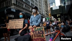 People take part in a march during the National Day of Resistance to schools re-opening amid the outbreak of COVID-19 in New York City, Aug. 3, 2020.