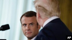 President Donald Trump speaks during a news conference with French President Emmanuel Macron in the East Room of the White House, April 24, 2018, in Washington. 
