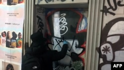 Graffiti artist Saynosleep paints a door in New York City on Dec. 15, 2020. 