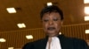 FILE - Chadian human rights activist and coordinator of defense counsel Jacqueline Moudeina stands in the courtroom during proceedings of the trial of Chadian dictator Hissene Habre, in Dakar, on July 20, 2015.