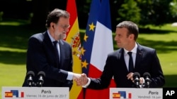 French President Emmanuel Macron and Spain's Prime Minister Mariano Rajoy attend a joint press conference after their meeting at the Elysee Palace in Paris, France, June 16, 2017.