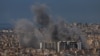 Smoke billows after reported strikes on Beirut’s southern suburbs, as seen from Baabda