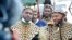 Prince Misuzulu Zulu, left, flanked by fellow warriors in traditional dress at the KwaKhangelamankengane Royal Palace, is pictured during a ceremony, in Nongoma, Zululand, KwaZulu-Natal, South Africa, May 7, 2021. 