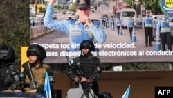 Honduras' Army soldiers stand guard at the National Institute of Professional Training (INFOP), from where the National Electoral Council (CNE) distributes the ballot boxes to be used in elections in Tegucigalpa on March 8, 2025. 