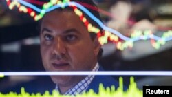 A trader works on the floor of the New York Stock Exchange shortly after the market opened in New York Sept. 1, 2015. 