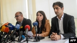 Turkish Kurd leader Abdullah Ocalan's lawyers (L-R) Faik Ozgur Erol, Newroz Uysal, Rezan Sarica prepare to read Ocalan's message during a press conference, May 6, 2019, in Istanbul.