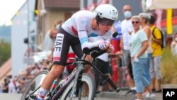 Slovenia's Tadej Pogacar in action during Stage 20 of the Tour de France cycling race, an individual time trial over 36.2 kilometers from Lure to La Planche des Belles Filles, France, Sept. 19, 2020.