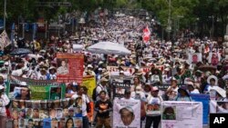 FILE— People attend the annual National March of Searching Mothers, held every Mother's Day in Mexico City, May 10, 2024. 