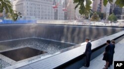 President Obama looks at the North Pool Memorial at the National September 11 Memorial in New York City.