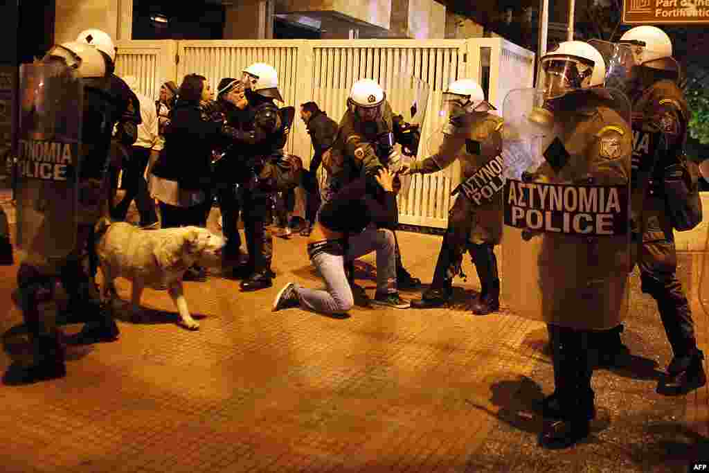 Riot police detain a protester during an anti-austerity rally outside the Greek parliament, in central Athens, on February 19, 2012. (AP)