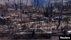 FILE — Fire scorched the Wahikuli Terrace neighborhood in the town of Lahaina on the island of Maui in Hawaii, Aug. 15, 2023. 