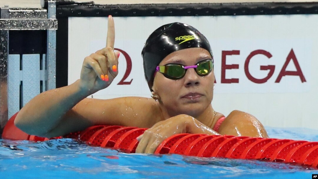Russia's Yulia Efimova celebrates winning a semifinal of the women's 100-meter breaststroke during the swimming competitions at the 2016 Summer Olympics in Rio de Janeiro, Brazil, Aug. 7, 2016.