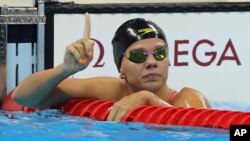 Russia's Yulia Efimova celebrates winning a semifinal of the women's 100-meter breaststroke during the swimming competitions at the 2016 Summer Olympics in Rio de Janeiro, Brazil, Aug. 7, 2016.