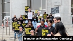 A group of Thai demonstrator holds the portraits of late Vicha Ratanapakdee, during a rally to raise awareness of anti-Asian violence outside the Hall of Justice, SF.