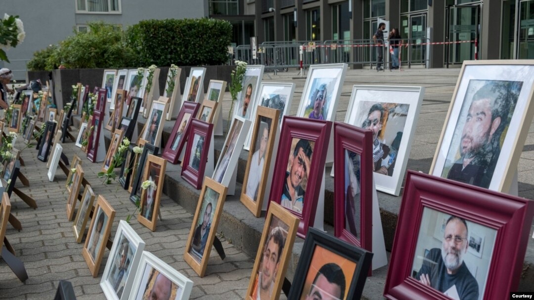 Portraits of Syrian detainees are seen at Koblenz court in Germany where trials started last June of two people alleged to be former Syrian intelligence officials involved in crimes against humanity inside Syrian prisons. (Courtesy: Maimouna al-Ammar)