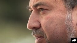 Israel's Foreign Minister Avigdor Lieberman looks on prior to his meeting with European Union foreign policy chief Catherine Ashton, not seen, in Jerusalem, Feb 15, 2011