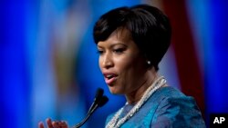 FILE - Washington Mayor Muriel Bowser, shown after taking the oath of office last month, defied a lawmaker's threat that she and other city leaders could face prison time for implementing a voter-approved marijuana law. 