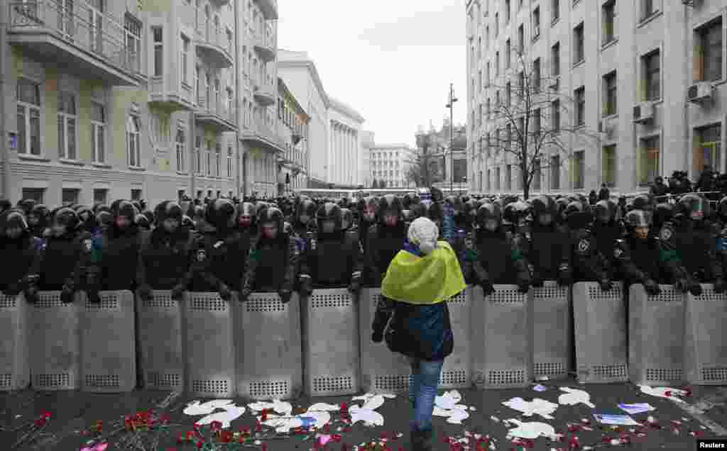 Riot police and Interior Ministry personnel block a street during a rally organized by supporters of EU integration in central Kyiv, Ukraine.