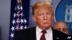 President Donald Trump listens during a briefing with reporters about border security in the briefing room of the White House, Jan. 3, 2019, in Washington.