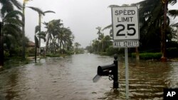 A street is flooded near the ocean after Hurricane Irma passed through Naples, Fla., Sept. 10, 2017. 