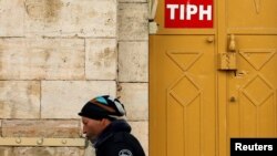 A sign of the Temporary International Presence in Hebron (TIPH) is seen on its office in Hebron, in the Israeli-occupied West Bank, Jan. 29, 2019. 