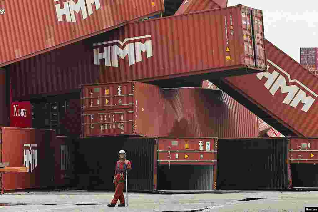 Fallen cargo containers are piled up after Typhoon Krathon made landfall in Kaohsiung, Taiwan.