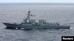 FILE - The USS Chafee, a US Navy destroyer which operates 100 percent on biofuel, sails about 150 miles (241 km) north of the island of Oahu during Naval exercises off Hawaii, July 18, 2012.