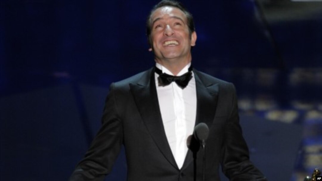 Jean Dujardin accepts the Oscar for best actor in a leading role for “The Artist” during the 84th Academy Awards on Feb. 26, 2012, in Hollywood.