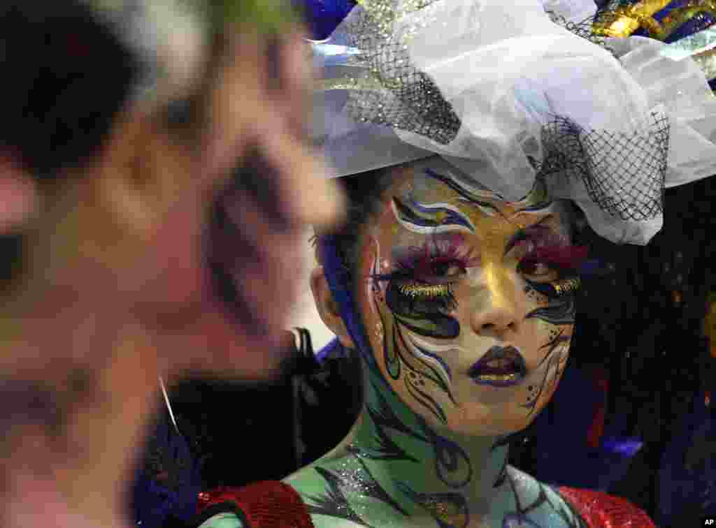 A model gets ready during Korea Aesthetic Seminar and Fair 2014 beauty therapy competition in Seoul, South Korea.