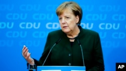 German Chancellor Angela Merkel addresses a new conference after a board meeting of her Christian Democratic Union party at the headquarters in Berlin, Nov. 27, 2017. 