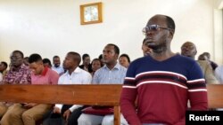 Tanzanian investigative journalist Erick Kabendera sits inside the Kisutu Residents Magistrate Court in Dar es Salaam, Tanzania, Aug. 5, 2019. 