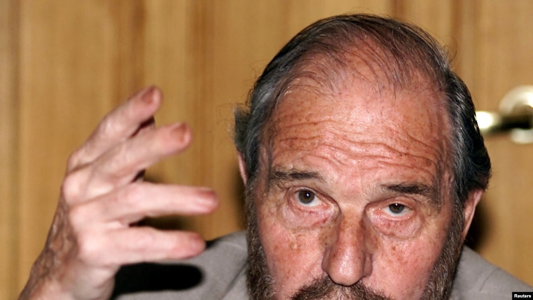 FILE - Soviet secret agent George Blake gestures as he speaks at a presentation of a book of letters written by other spies from a British prison, in Moscow June 28, 2001.