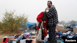 Travis Lee Hogan, of Paradise, comforts his mother, Bridgett Hogan, while they stay at a makeshift evacuation center for people displaced by the Camp Fire in Chico, California, U.S., November 15, 2018. 