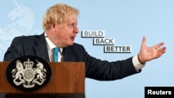 British Prime Minister Boris Johnson delivers a speech at Exeter College Construction Centre, part of Exeter College in Exeter, Britain, Sept. 29, 2020.