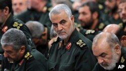 FILE - Revolutionary Guard Gen. Qassem Soleimani, center, attends a meeting in Tehran, Iran, Sept. 18, 2016.