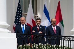 Israeli Prime Minister Benjamin Netanyahu, left, UAE Foreign Minister Abdullah bin Zayed al-Nahyan, and Bahrain Foreign Minister Khalid bin Ahmed Al Khalifa stand at the White House during the Abraham Accords signing ceremony, Sept. 15, 2020.