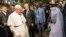 Pope Francis arrives at the Central Mosque in the PK5 neighborhood to meet with members of the Muslim community in Bangui, Nov. 30, 2015.. 
