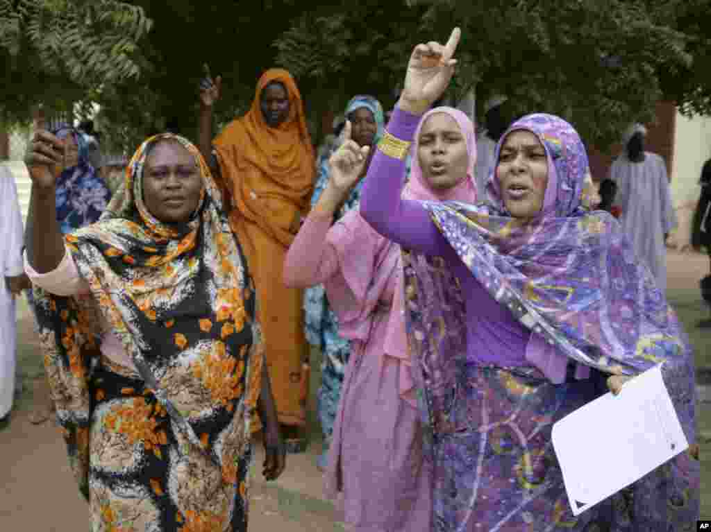 Sudanese women chant slogans during a protest in Khartoum, Sudan, Sept. 14, 2012.